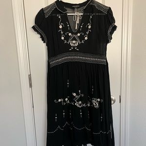 Black dress with white embroidery